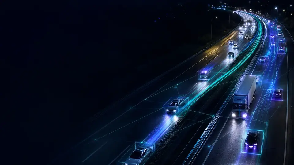 Highway at night seen through a camera, with vehicles tagged by artificial intelligence